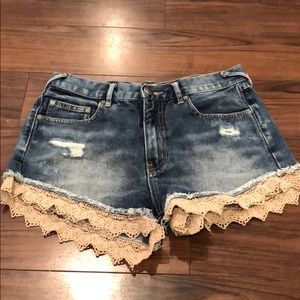Free people jean shorts with lace trim